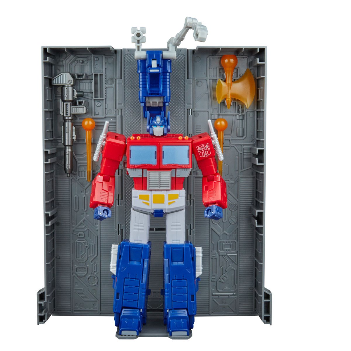 Transformers Studio Series Commander Class SS 86 Optimus Prime standing in front of trailer
